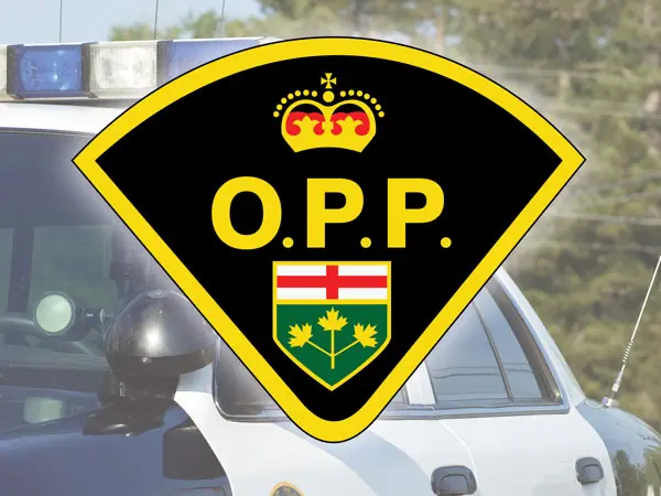 Ontario Provincial Police badge with crown and shield emblem.